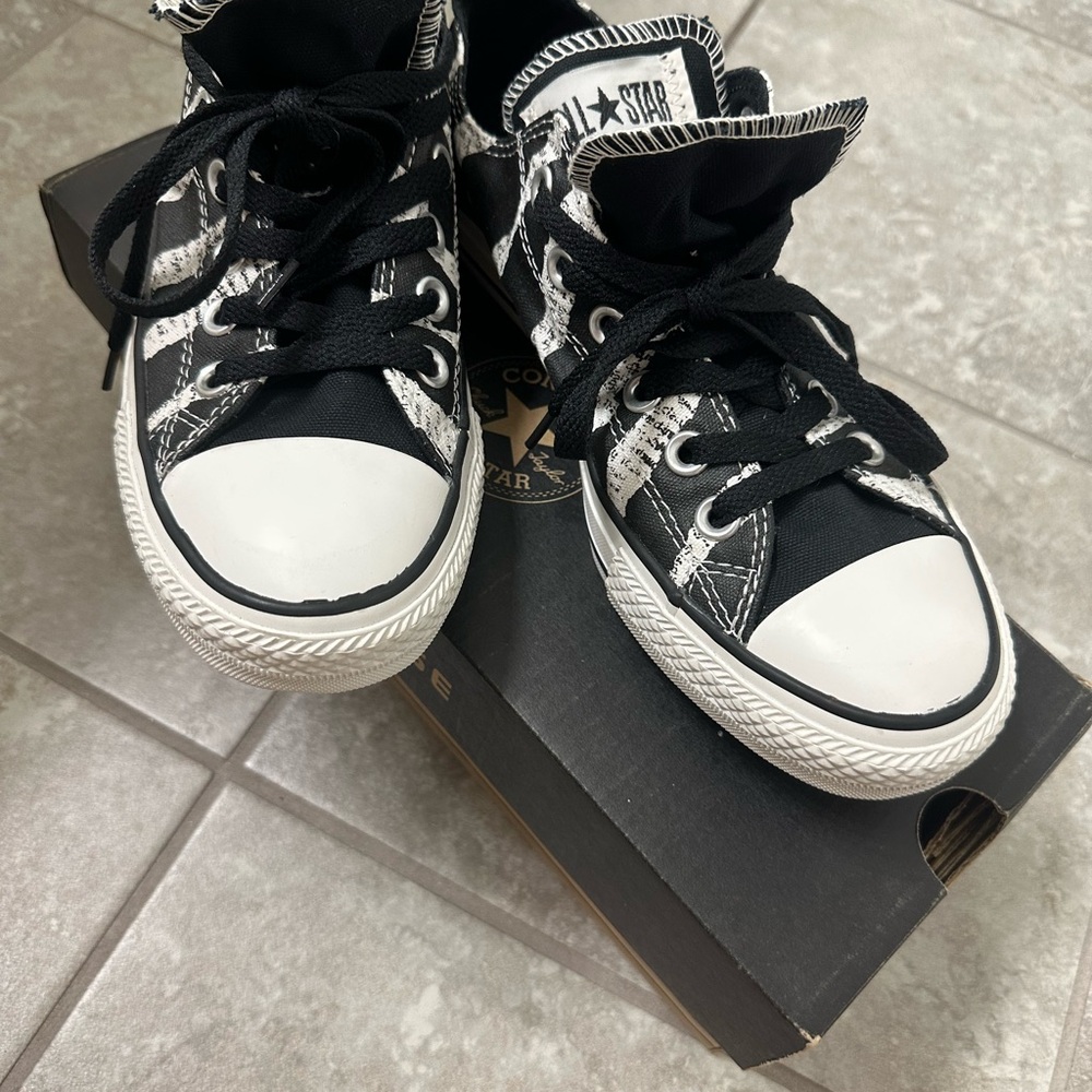 New. Never worn. Converse Black and White High-Top Sneakers